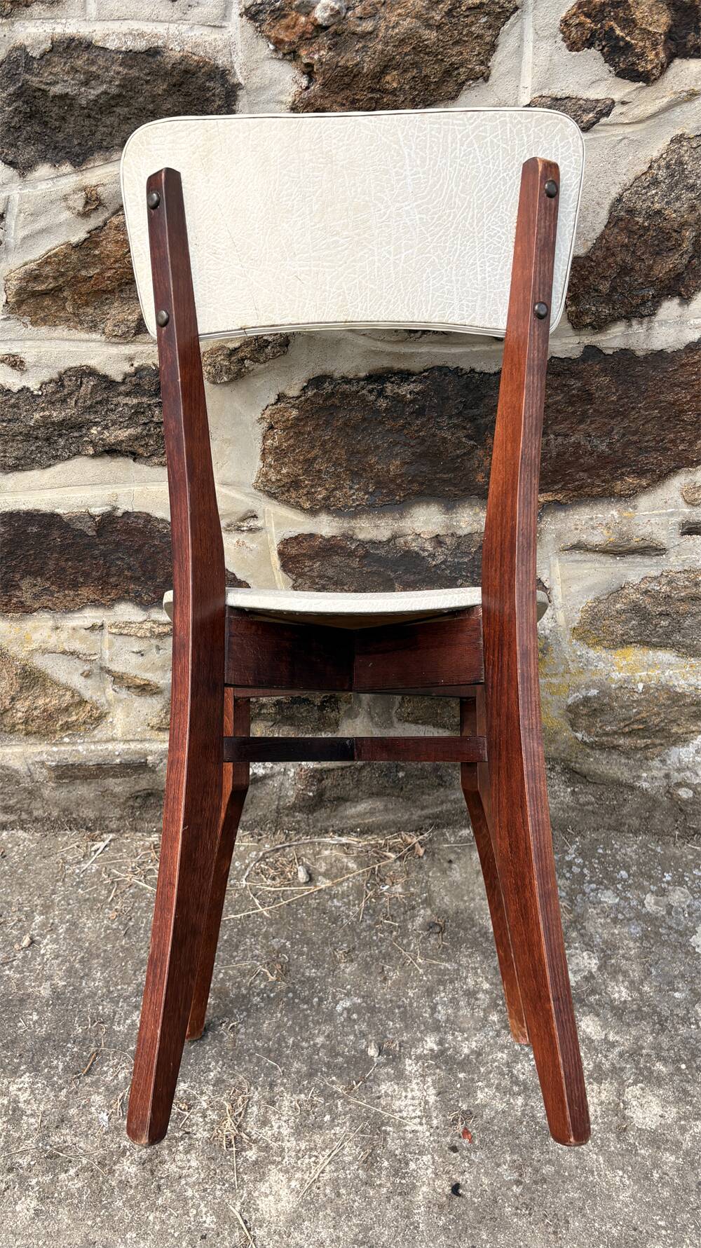 Pair of vintage chairs with upholstered backrest and seat, 1950s style.