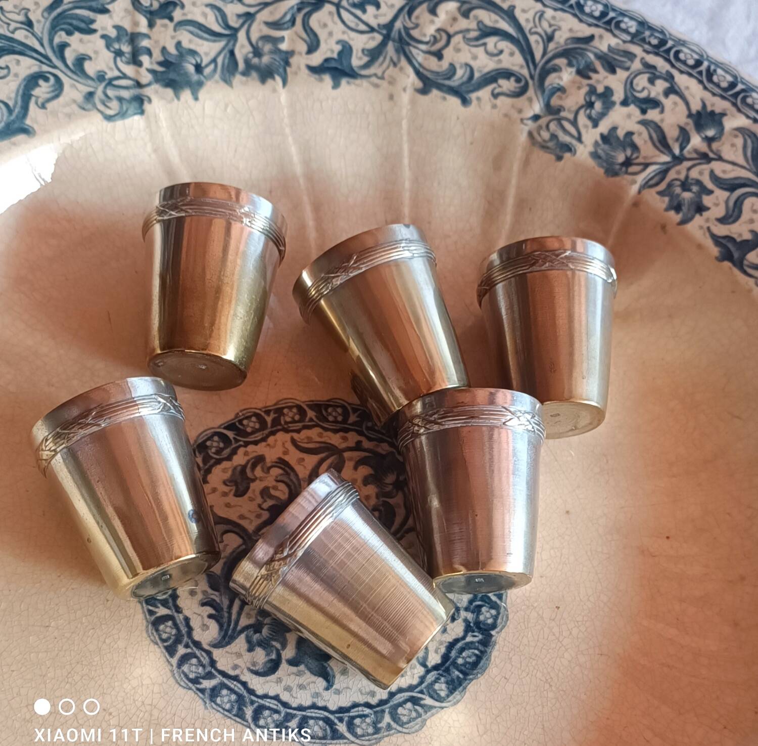 6 silver-plated metal glasses, decorated with a chased ribbon design