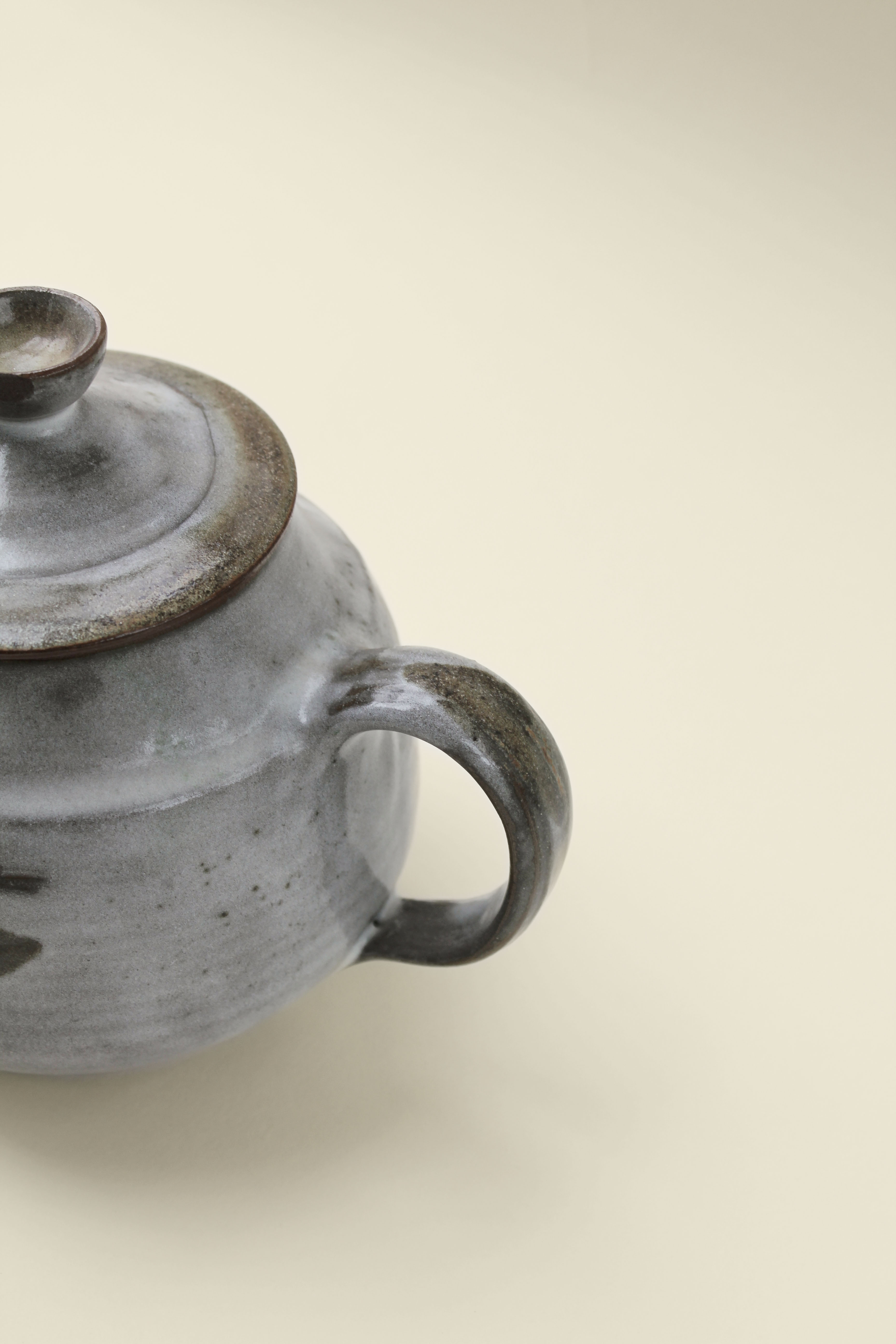 Sandstone teapot with floral pattern
