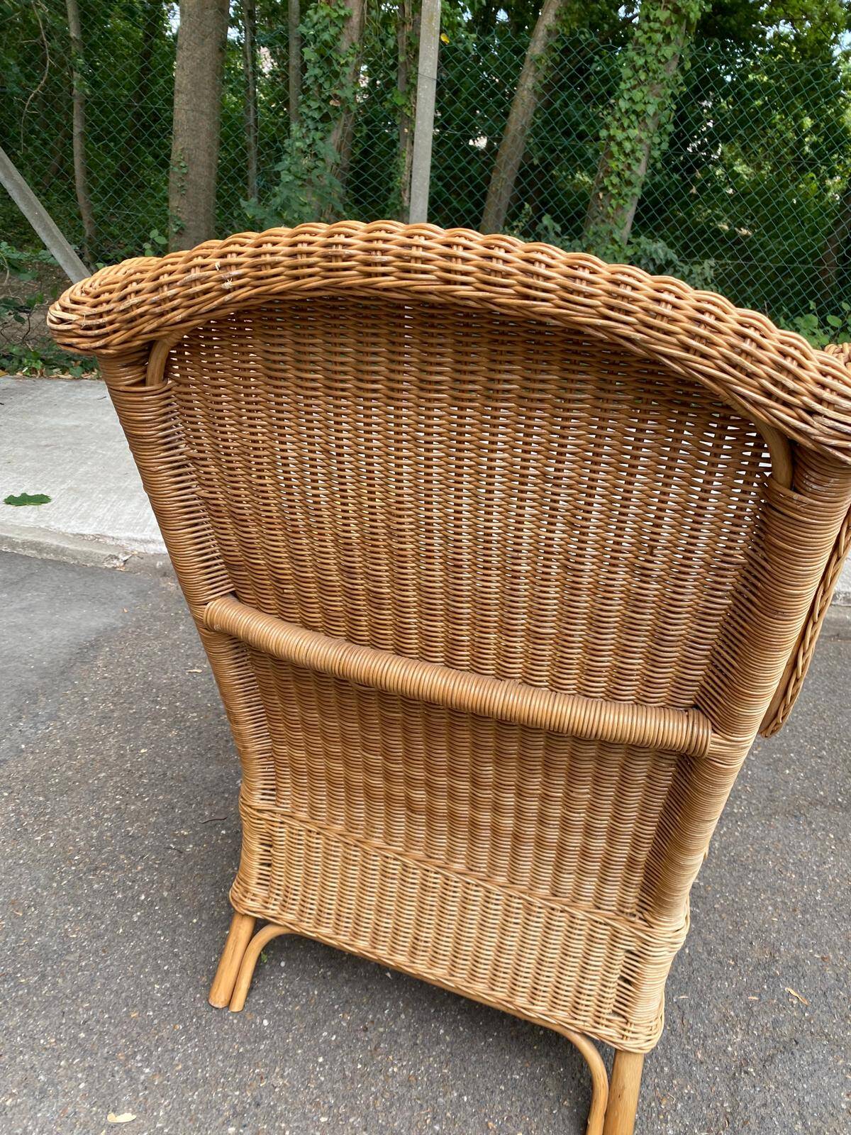 2 rattan and woven wicker armchairs in vintage 70s style