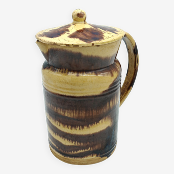 Pitcher covered in glazed earth old french tabby dishes