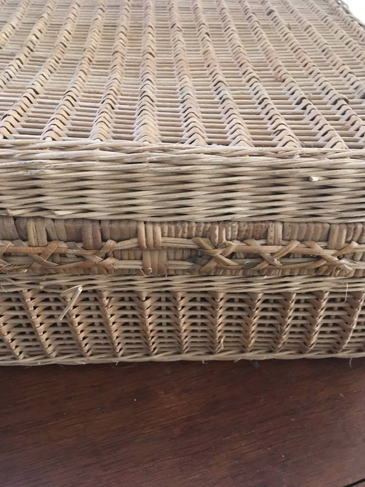 Wicker suitcase.