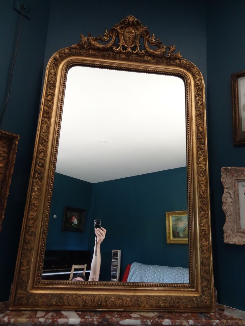 Mirror XIXth in gilded stucco, H 142 cm