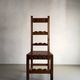 2 brutalist carved wood dining chairs with leather seat | The Netherlands | 1970s