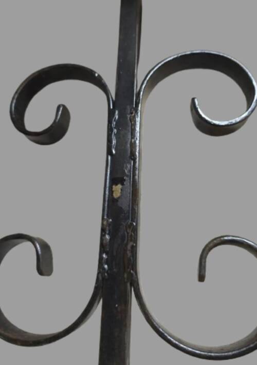 Pair of wrought iron candlesticks with cast bronze ball, 1970s.