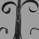 Pair of wrought iron candlesticks with cast bronze ball, 1970s.