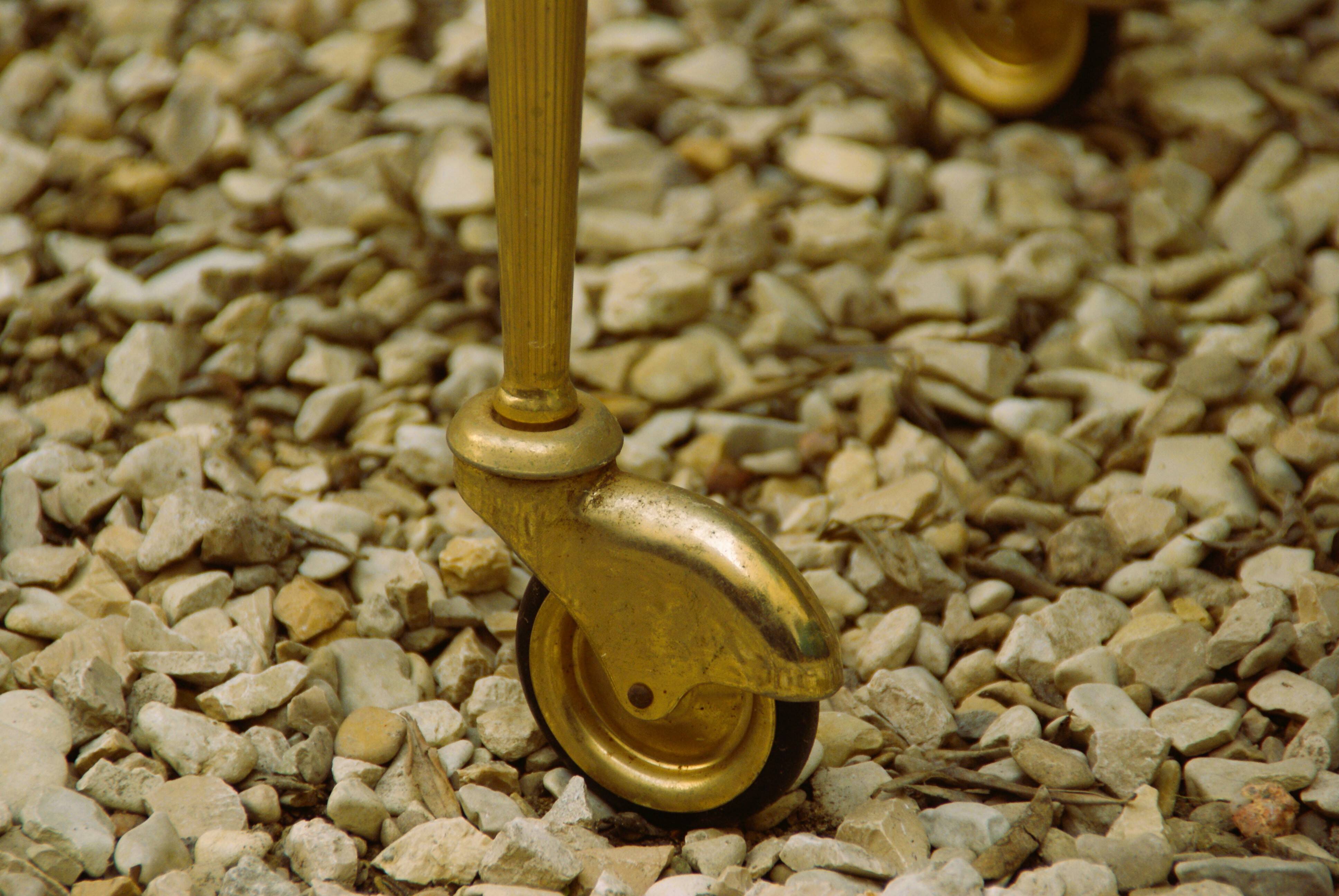 Antique brass serving trolley with smoked glass top, Louis XVI style.