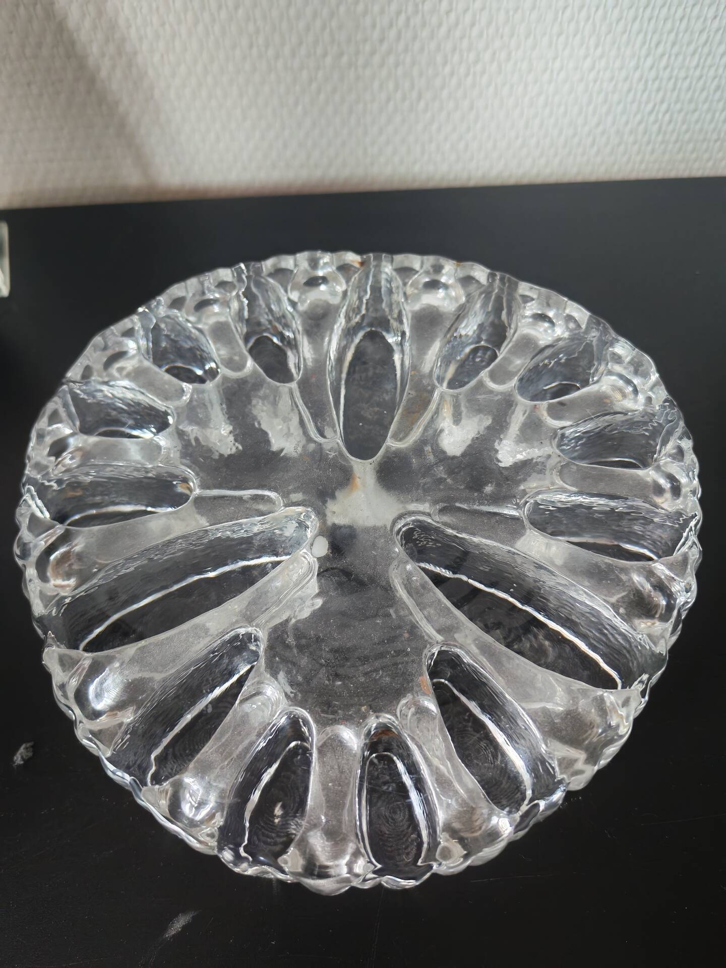 Large glass candle holder in iceberg brutalist style.