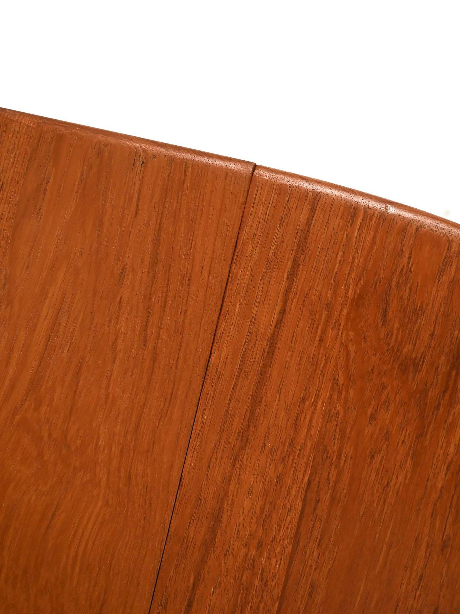 Round extendable teak table by Svante Skogh