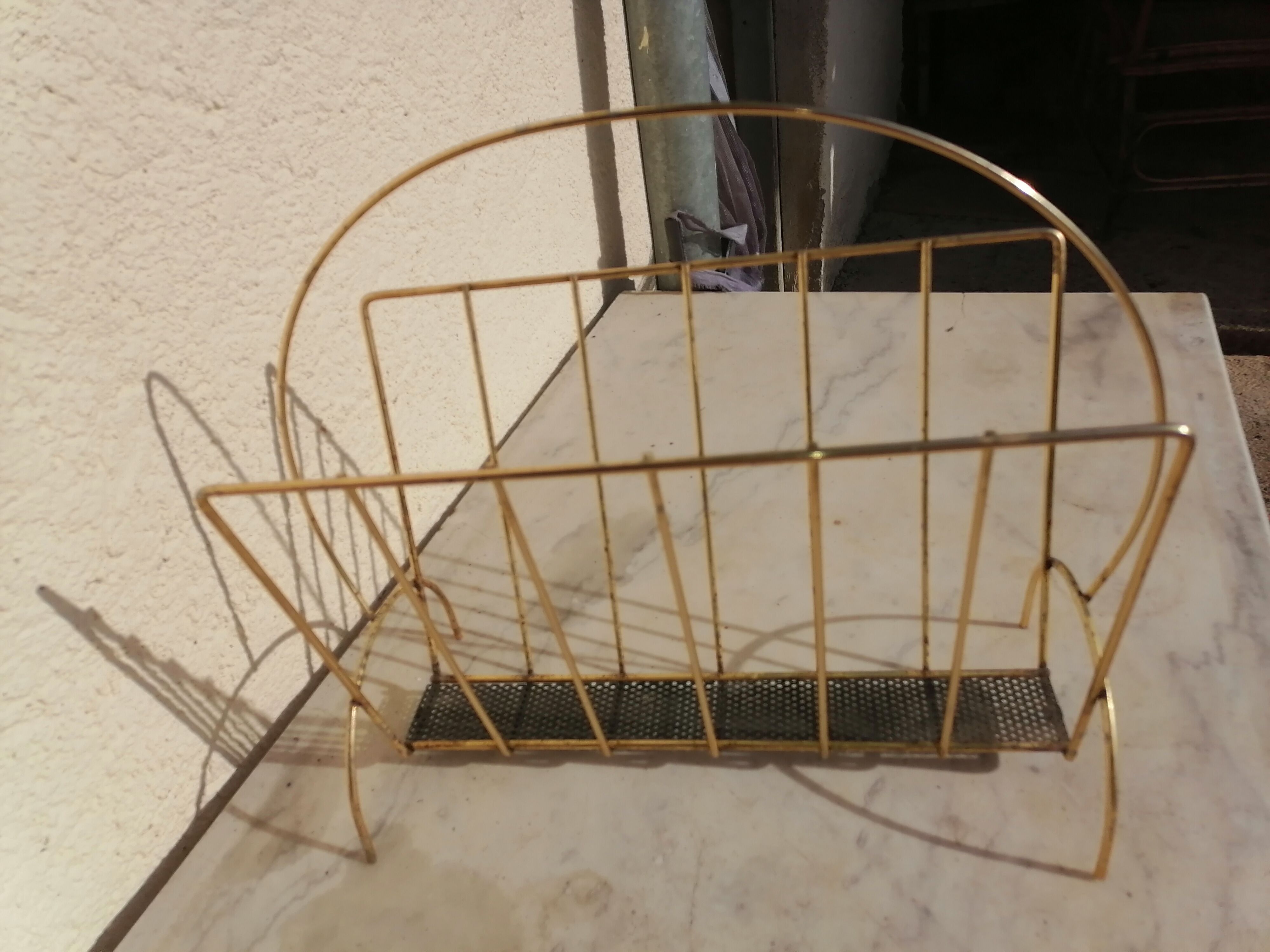 Vintage metal metal perforated magazine holder
