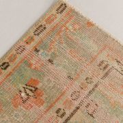 Tapis vintage rouge pâle