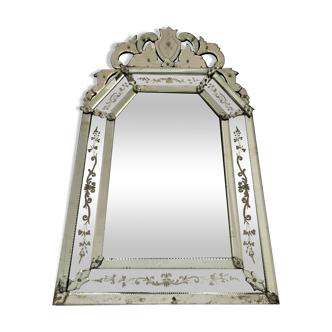 Old Venetian mirror with floral decoration and pediment