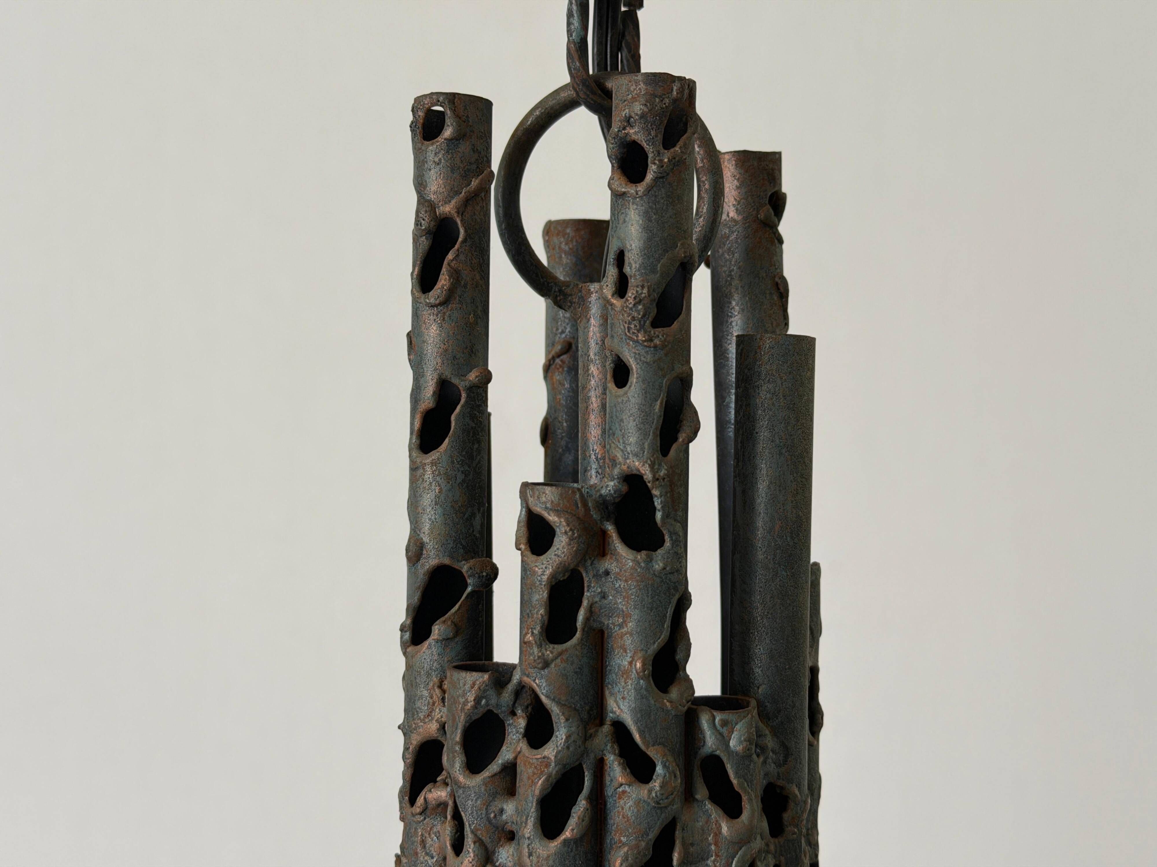 Three-armed suspended lamp in wrought iron, brutalist design, 1960s, Italy.