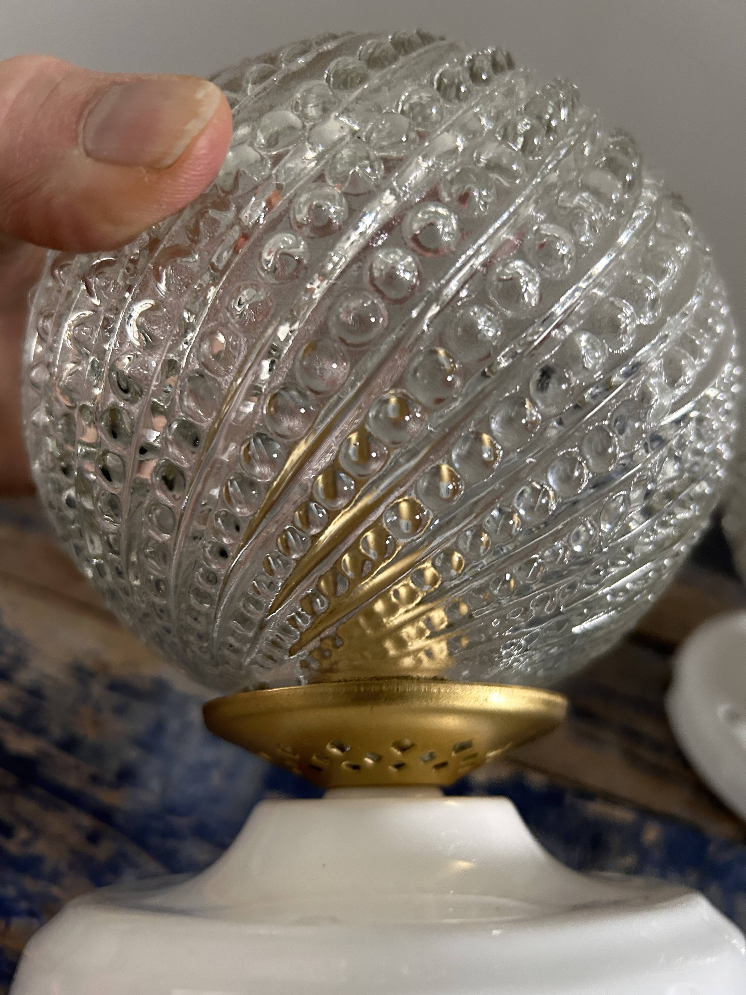 Set of two chiseled glass globe wall lights