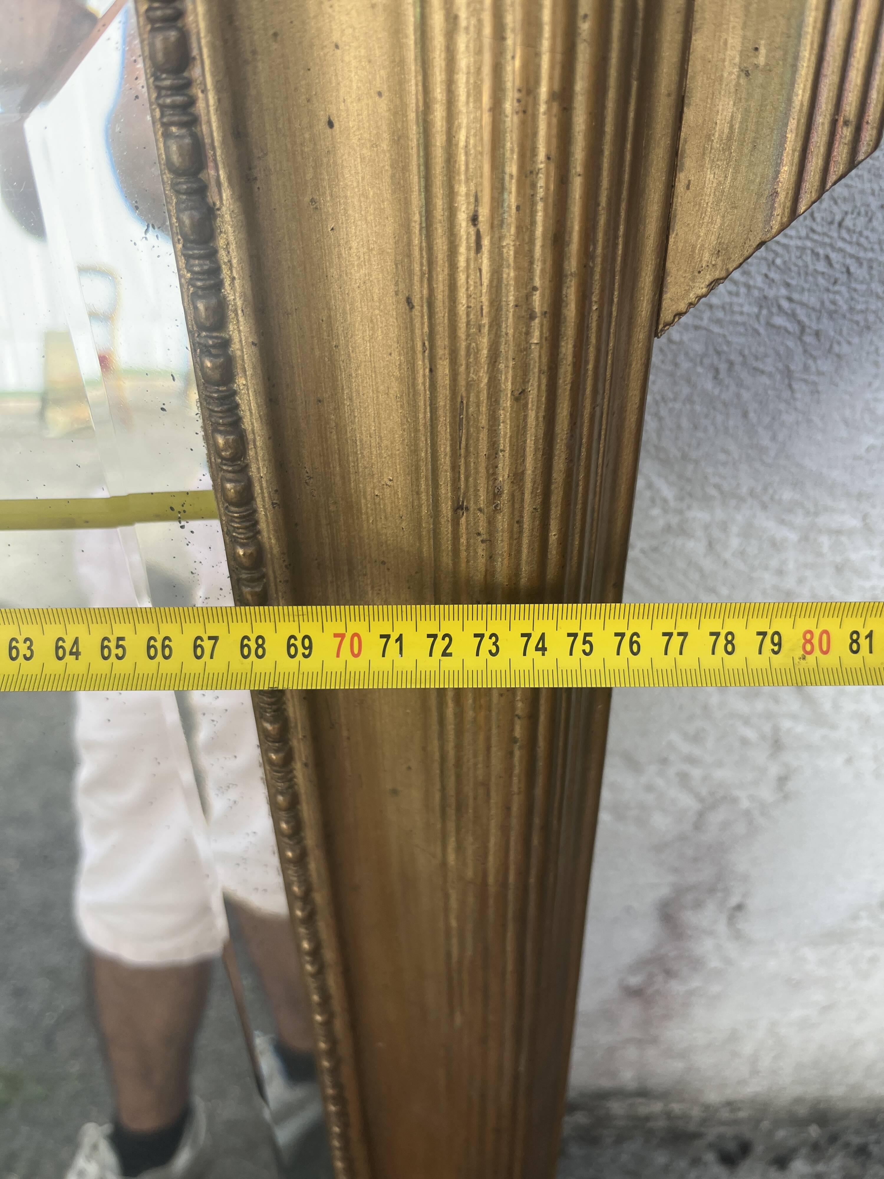 Large antique gilded mirror with carved pediment, 126 cm