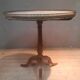 Circular pedestal table with white marble top