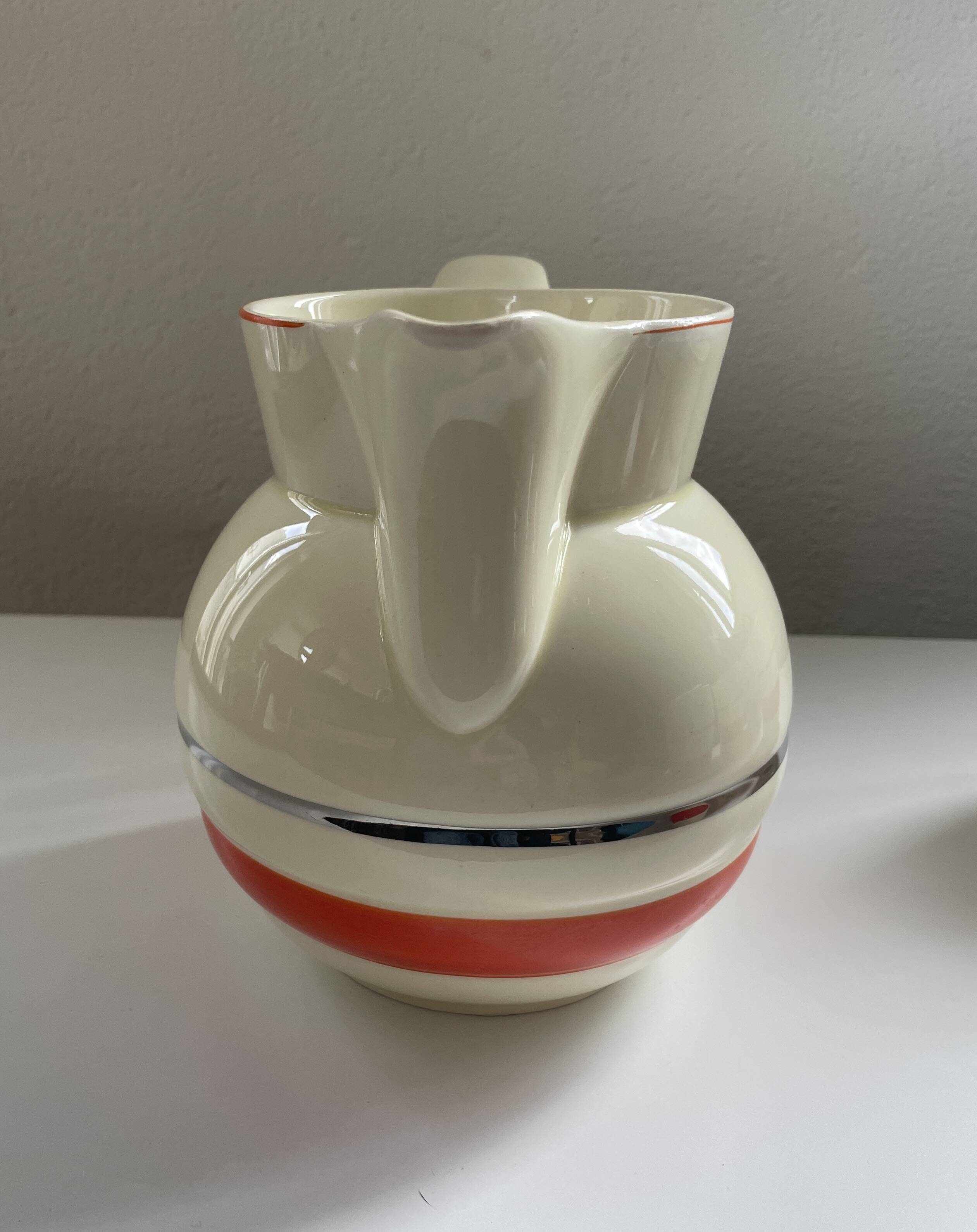 Red, white and silver porcelain jug set by Edmond Bellefroid for Robo.