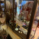 Dark-stained wood and glass vintage display cabinet — early 20th-century wall-mounted showcase