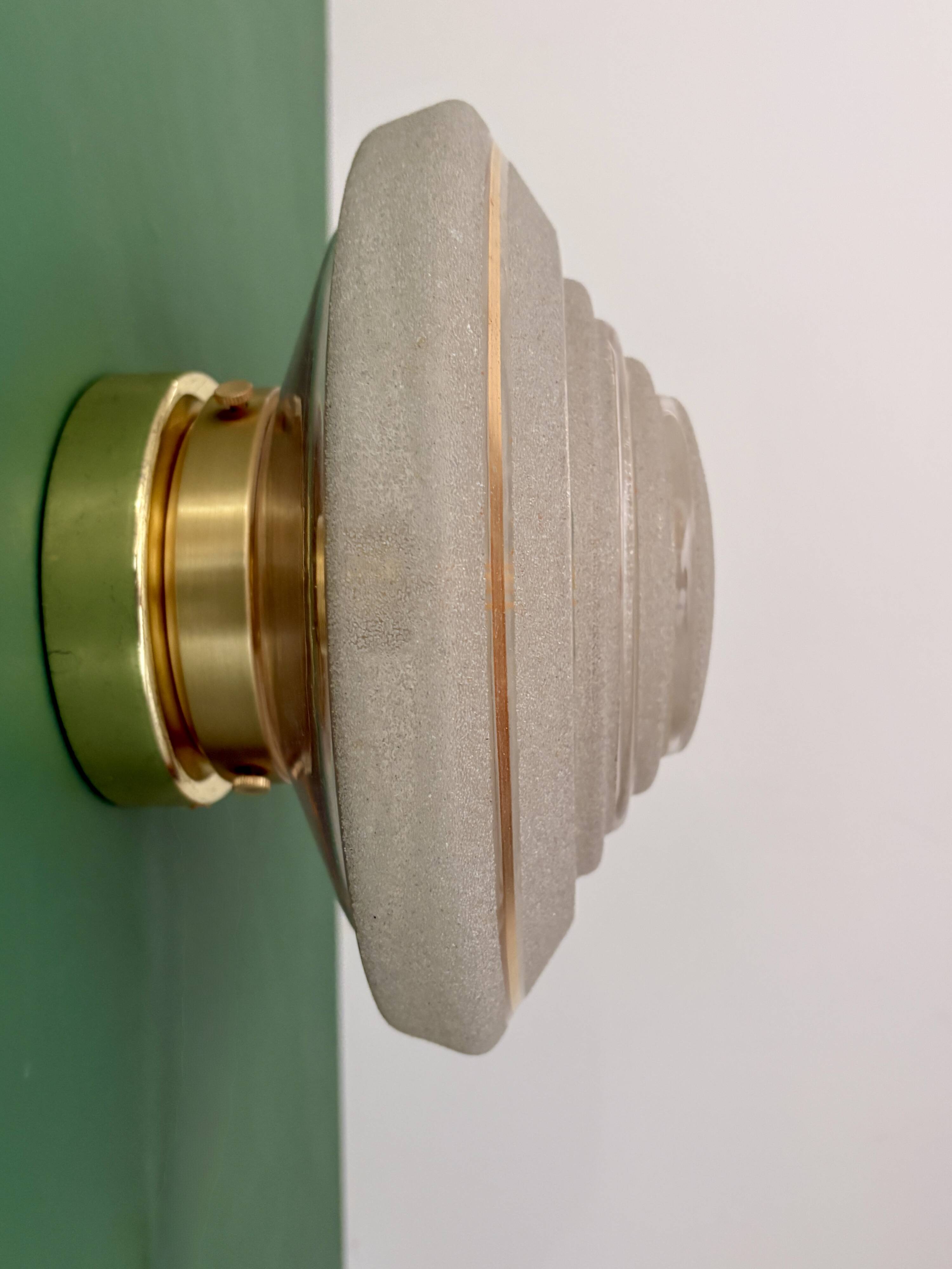 Old glass globe wall/ceiling light in frosted white and gold.