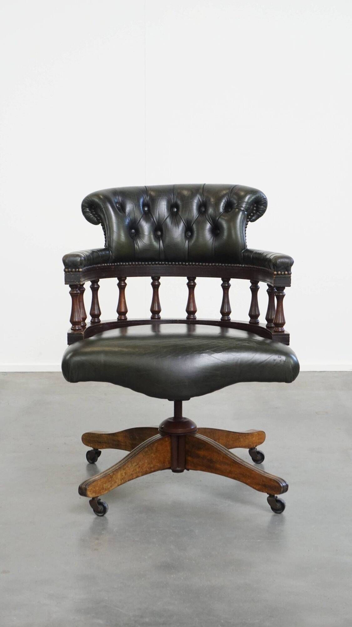 Green leather height-adjustable, swivel and tilt chesterfield office chair