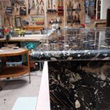 Black travertine eye coffee table
