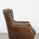 Very comfortable vintage cow leather armchair with character