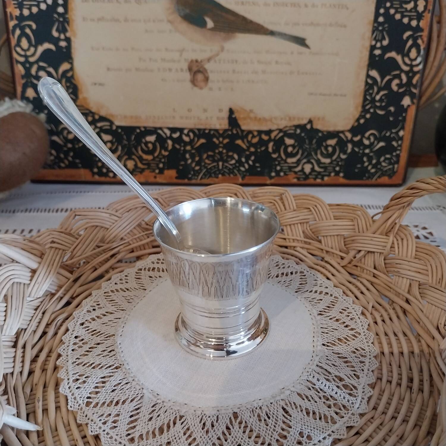 Egg cup and spoon in silver metal
