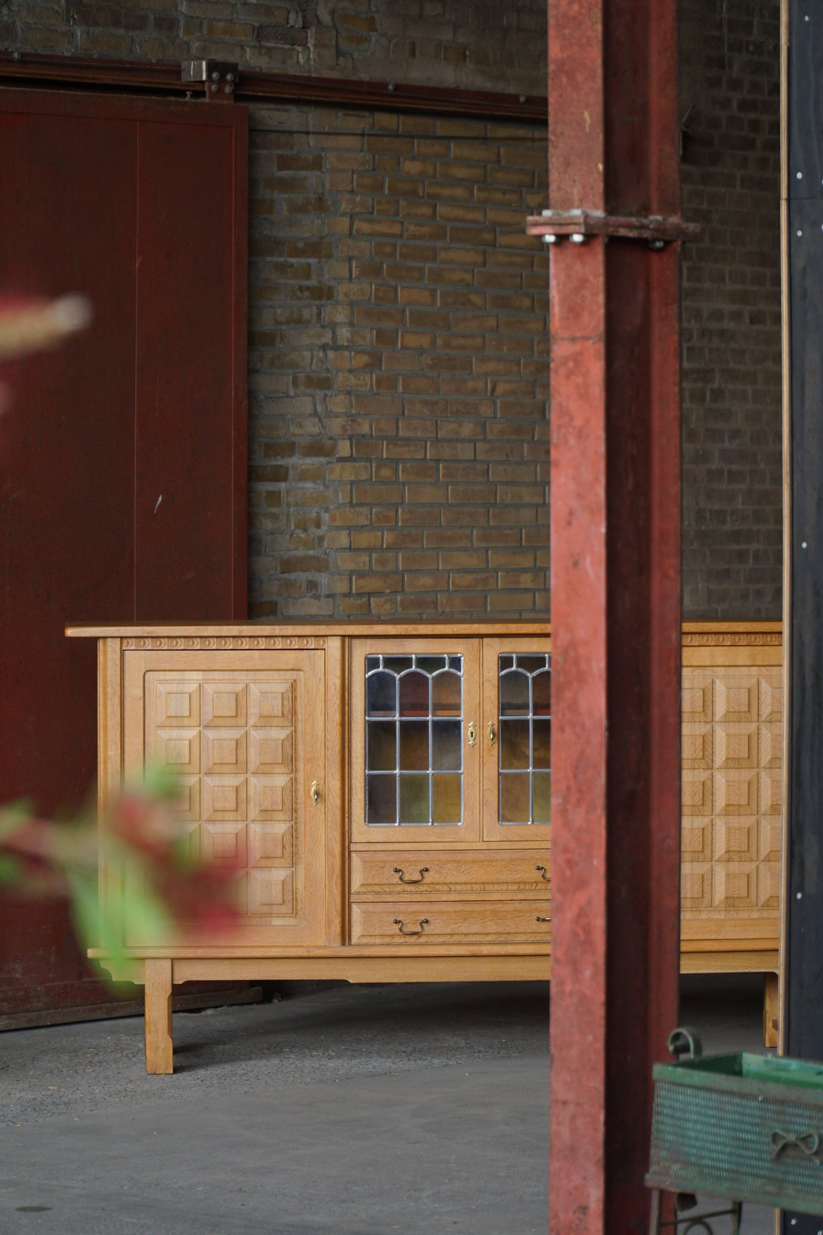 Danish oak buffet with lead glass doors, Henning Kjærnulf, Denmark, 1960s
