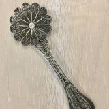 silver sprinkler spoon