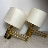 Two wall lights with articulated arm in gold metal Egolux