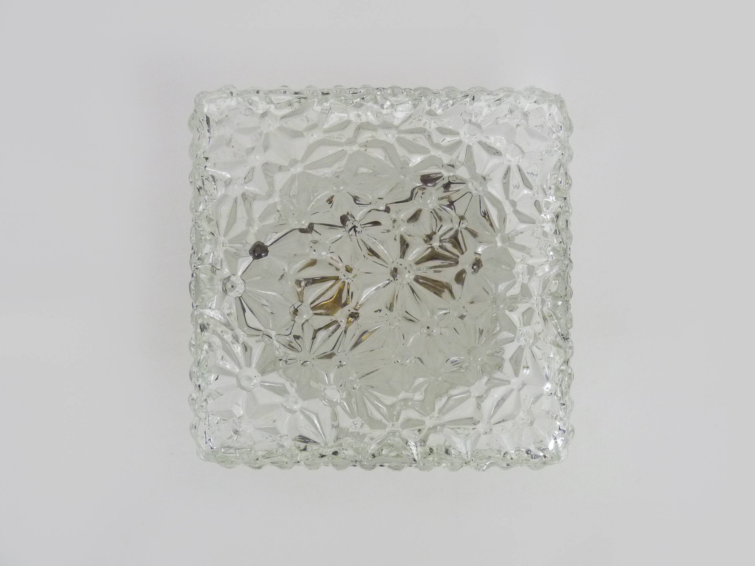 Wall lamp or ceiling light in glass and metal from the 50s and 60s.