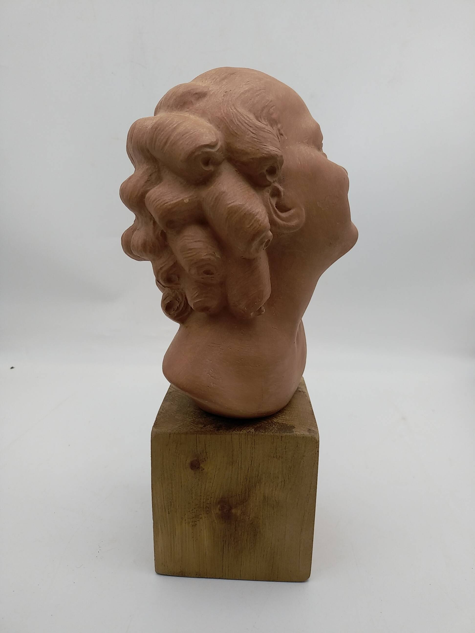 Bust young smiling girl. Circa 1900. Art Deco. Signed.