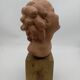 Bust young smiling girl. Circa 1900. Art Deco. Signed.