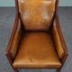 Armchair in sheepskin with wood