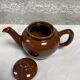 Brown glazed ceramic teapot