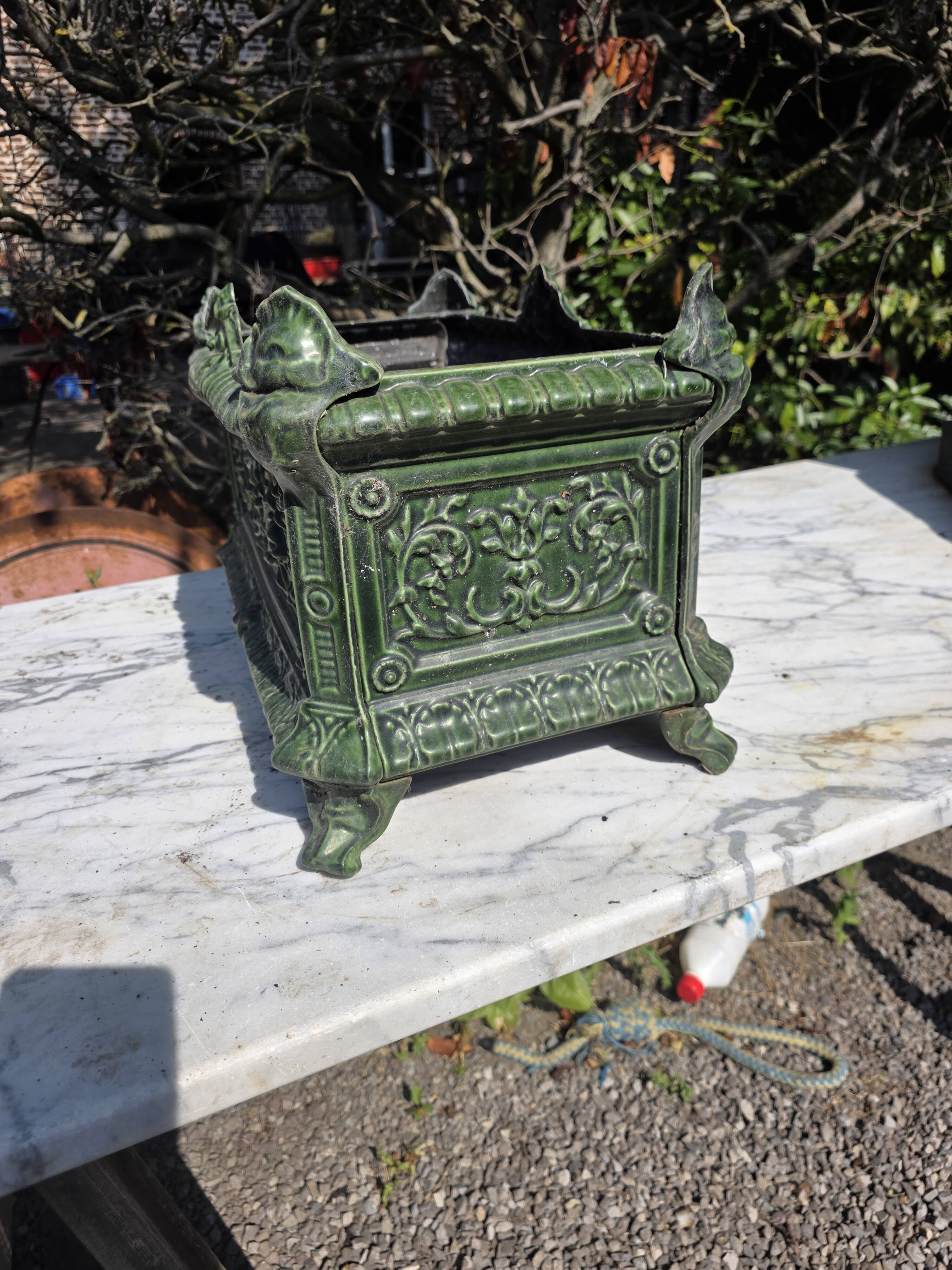 Antique enamelled cast iron planter in the Napoleon III style.