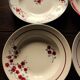 A set of 4 mismatched Art Deco red blue soup plates