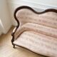Living room set: Louis XV sofa and armchair in wood and pink fabric.