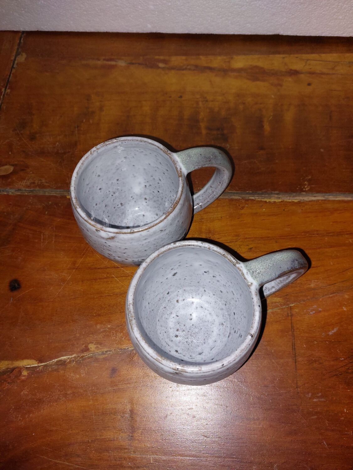 Two glazed stoneware mugs