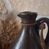 Dark brown stoneware jugs and pitchers with their cord