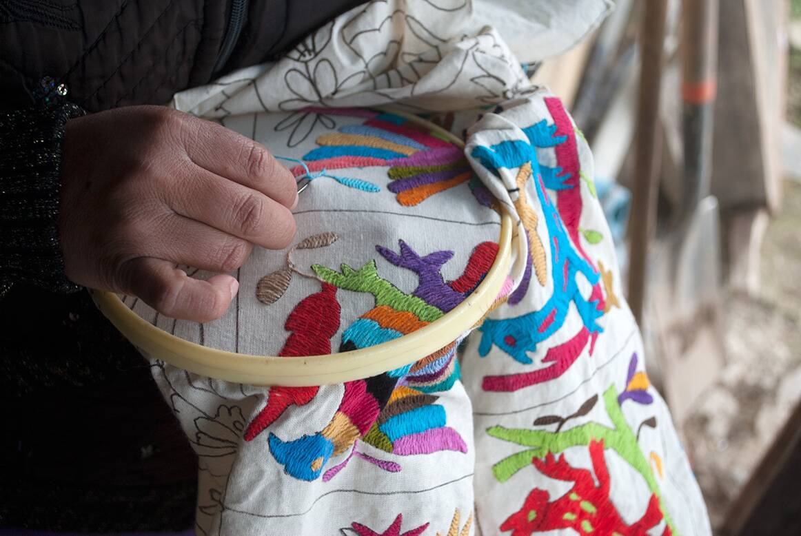 Hand-embroidered cushion