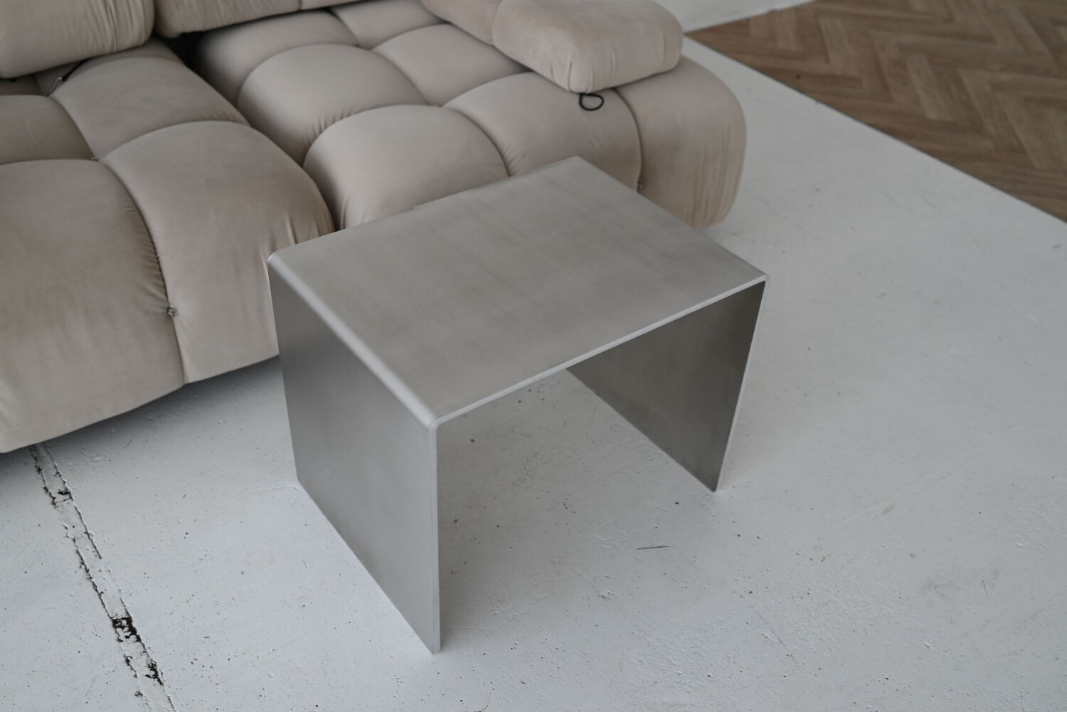 Minimalist brushed aluminum side table