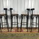 Suite de 4 tabourets de bar en cannage et bois noirci