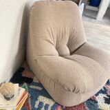 Vintage armchair reupholstered in boucle fabric.