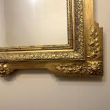 Antique Louis XVI style mirror in gilded wood