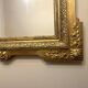 Antique Louis XVI style mirror in gilded wood