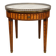 Bouillotte table in Louis XVI style with marquetry, marble, and brass.