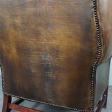 Patinated cowhide leather armchair