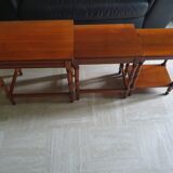 Nesting tables in solid cherry wood held together by slides