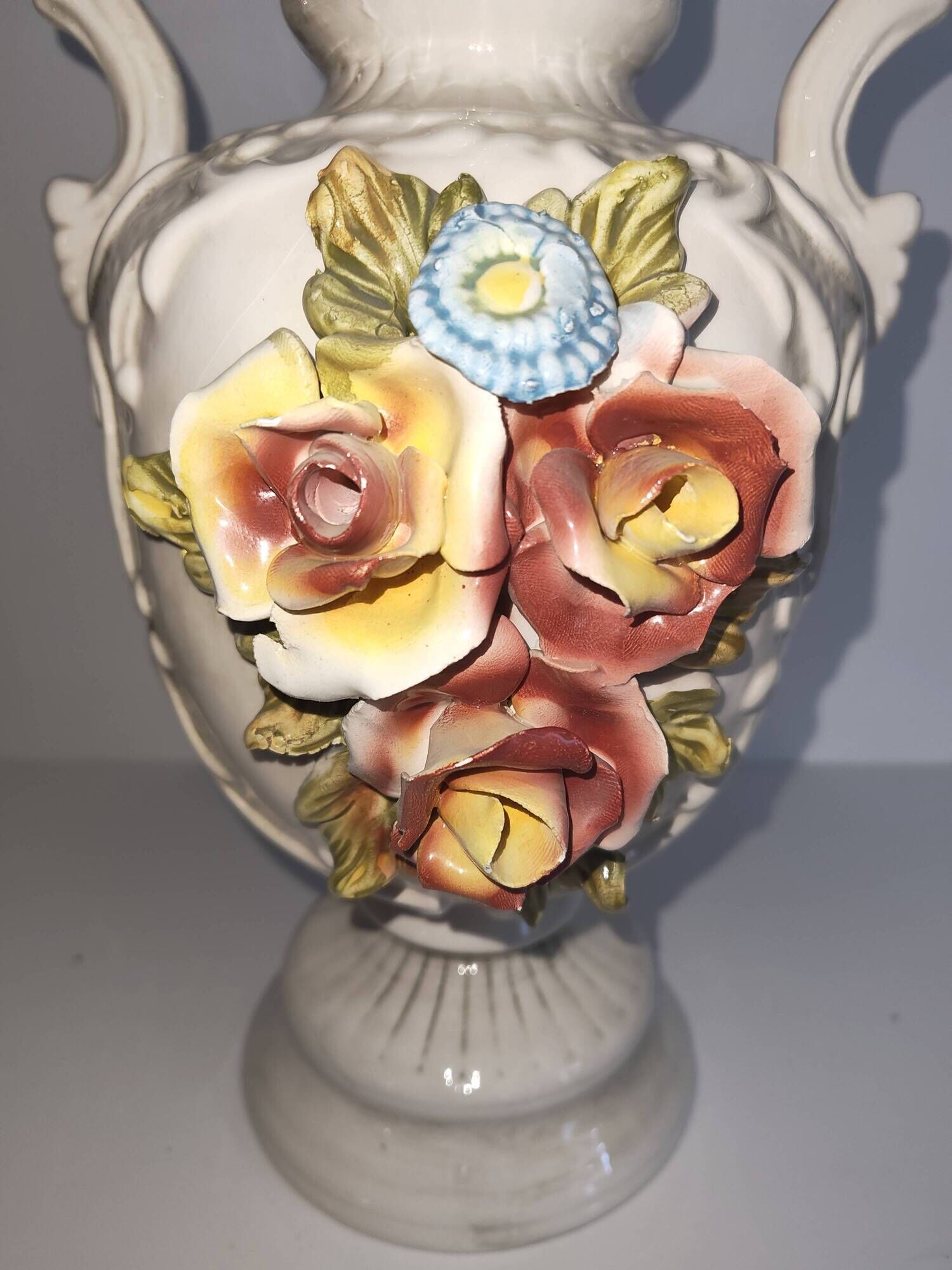 Vintage Italian white ceramic vase with raised floral decoration.